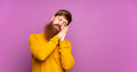 Redhead man with long beard over isolated purple background making sleep gesture in dorable expression