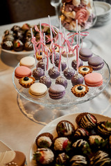 Large sweet table with many delicious and beautiful cookies and muffins
