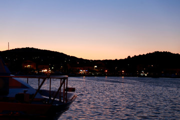 Boat harbour in Croatia during sunset. Romantic picture from summer vacation. Port in Croatia. 
