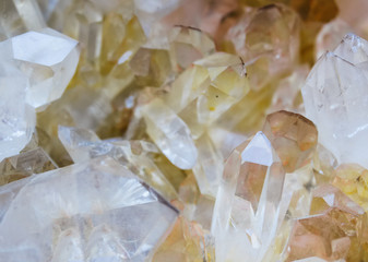 Background, smoky quartz crystals cluster close-up, in the rock. The most common mineral