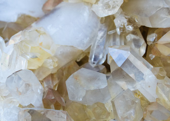 Background, smoky quartz crystals cluster close-up, in the rock. The most common mineral
