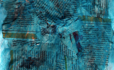 Old grunge paper texture with newspaper collage and teal stains.
