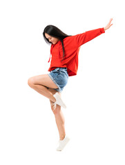 Young asian dancer over isolated white background