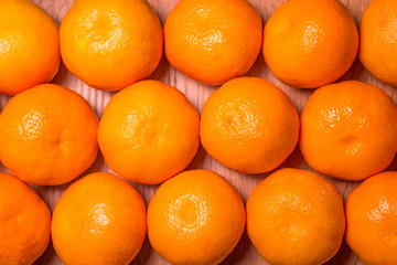 Fresh mandarin oranges fruit or tangerines, as background.