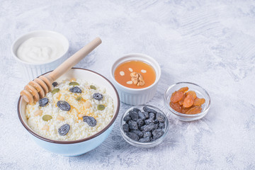 Сurd on a plate with raisin, honey, pumpkin seed. Healthy breakfast Cottage cheese