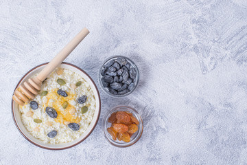 Сurd on a plate with raisin, honey, pumpkin seed. Healthy breakfast Cottage cheese