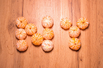 New Year symbol made of tangerines, background for the new year