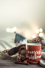 Festive background with a Cup and the inscription merry Christmas.