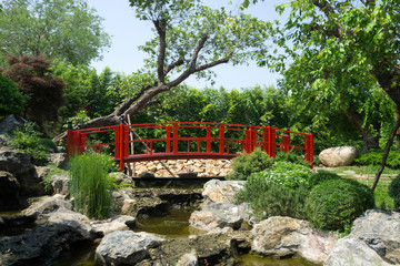 Fototapeta na wymiar Japanese garden style with red bridge