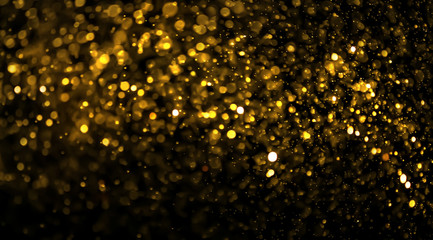abstract golden bokeh light on black background