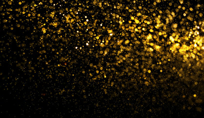 abstract golden bokeh light on black background