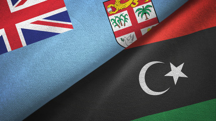 Fiji and Libya two flags textile cloth, fabric texture