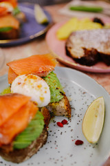 Avocado toast with egg and smoked salmon. 