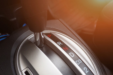 Closeup of automatic transmission in the car for modern design and interior. Gear stick and car...