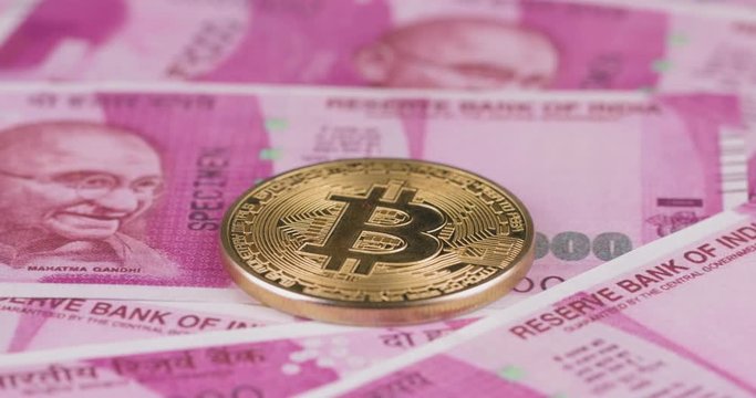 4k resolution of a cryptocurrency gold Bitcoin coin on a Indian rupee