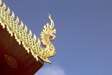 Fototapeta na wymiar Dragon stucco on the temple roof,in Thailand.