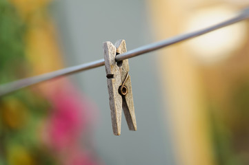 One clothespin hanged on metal wire