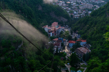 BORJOMI, GEORGIA - JUNE 27, 2019: One of the favorite tourist attractions in resort is the cable car ride over the Mineral Water Park and Borjomi