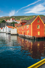 Historical red and white buildings in Bryggen - Hanseatic wharf in Bergen, Norway. Scenic summer...