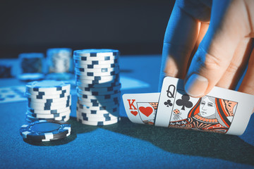 Man plays poker in the casino - obrazy, fototapety, plakaty