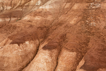 Red hills in canyon. Red colored rocks. Old bed of river in gorge