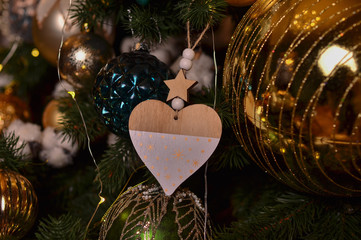  Heart figurine made of wood. New Year tree with decorations. 