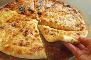 Mouthwatering Fresh Baked Cheese-filled Georgian Flatbread Called Khachapuri Imeruli (Imeretian) 