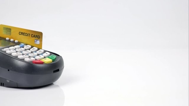 Stop motion Credit card reader machine or Payment terminal with credit card on table