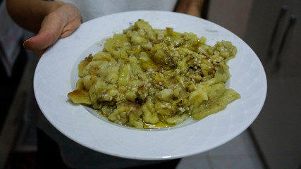Roasted eggplant salad on plate. Traditional appetizer which have been eaten with raki.