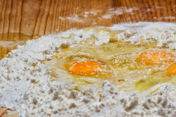 flour fountain with three eggs