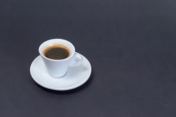 black coffee in a coffee cup from above isolated on black background. with clipping path.