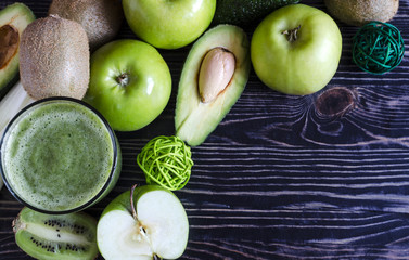 smoothie of fruits and greens in a transparent glass, the concept of healthy natural food background
