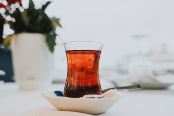 Turkish tea, glass saucer spoon background blurred. Istanbul