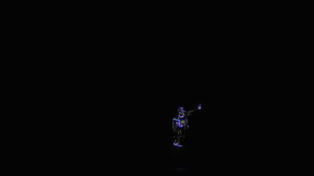Dancer in a LED costume with a book