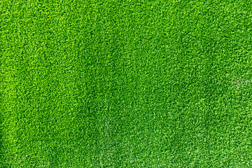 Plakat Texture of fake green grass for background or backdrop.