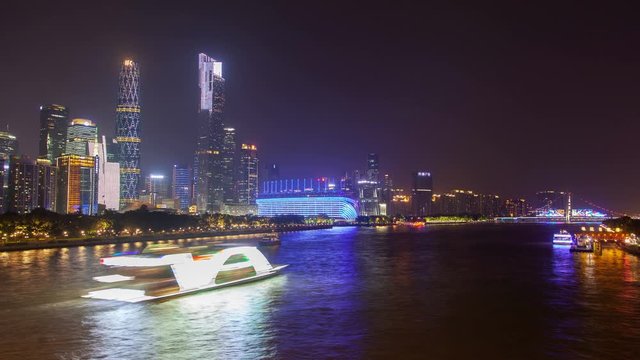 Guangzhou skyscrapers on Pearl river bank in China timelapse zoom out