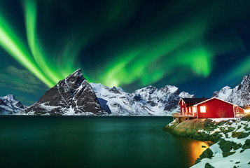 Aurora borealis over winter landscape - lofotens - Norway