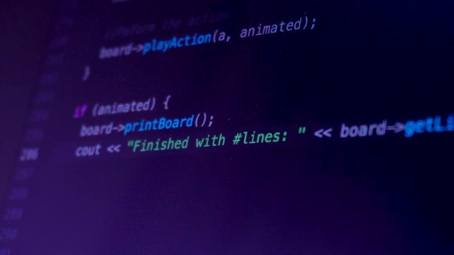 Developer programming and writing code on computer