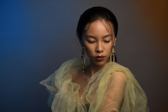 Studio portrait of young beautiful asian woman