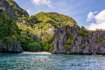 Sandy tropical beach among the rocks in El Nido Palawan Philippines