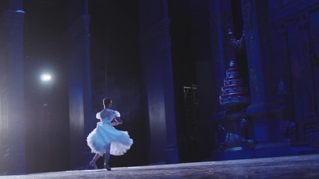 Classic ballet ballerina dancing on stage on Pointe