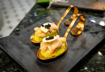 Beautiful Sushi otaro avocado on copper spoon,japanese cruisine,asia