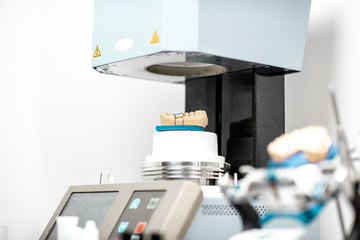 Professional oven with artificial jaw, baking enamel dentures at the laboratory