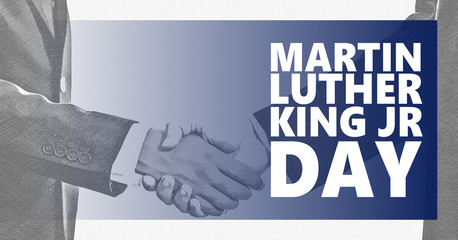 Martin Luther King jr day. White and black handshaking background.