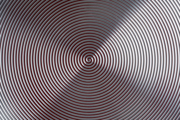 Hypnosis spiral carved on painted aluminum.