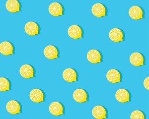 Trendy sunlight Summer pattern made with yellow lemon slice on bright light blue background. Minimal summer concept.
