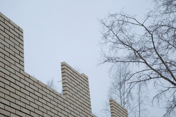 Laying bricks. Making a brick wall.Construction of a brick house.