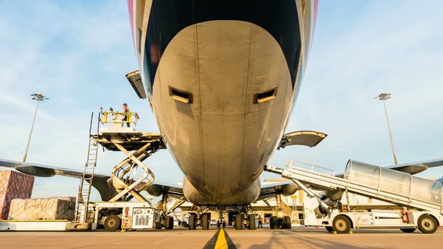Zoom out time lapse cargo aircraft loading	