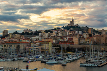 Marseille Old Port, France with Our Lady of the Guard (Notre-Dame de la Garde) church on the hill and old port