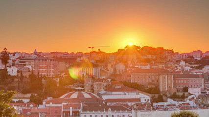 Sunrise over Lisbon aerial cityscape skyline timelapse from viewpoint of St. Peter of Alcantara, Portugal.